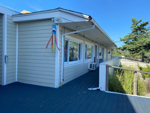 awning over the front porch of a house at Grove Hotel in Cherry Grove