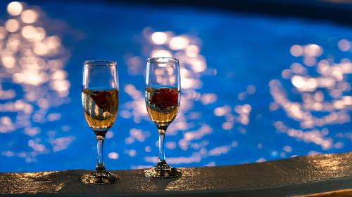 two glasses of wine sitting on a table at Villa Echedra in Vlychada