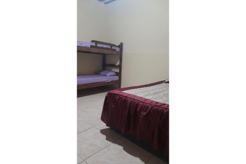 Una cama o camas en una habitación de Cantinho e Sossego n 3