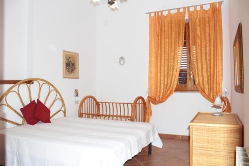 Ένα ή περισσότερα κρεβάτια σε δωμάτιο στο Appartamento Mare Trappeto