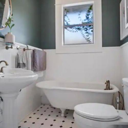 a bathroom with a tub and a toilet and a sink at Family Vacation Home in Tampa, Florida in Tampa