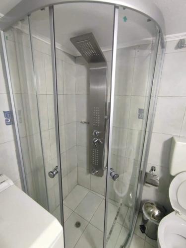 a shower in a bathroom with a toilet at VIEW OF CASTLE in Monemvasia