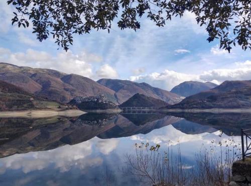 a view of a body of water with mountains at Casa sul lago Nonna Gio' in Colle di Tora