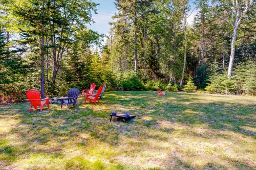 a group of chairs sitting in a yard at Our Barn in Marlboro