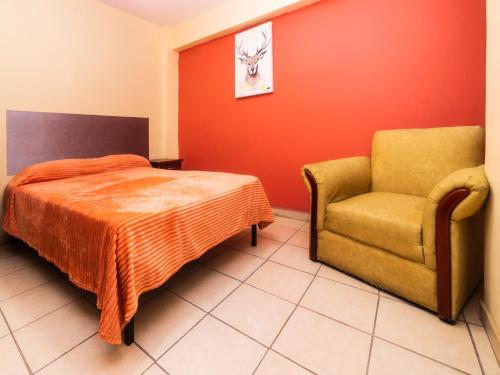 Säng eller sängar i ett rum på Hotel Zaragoza