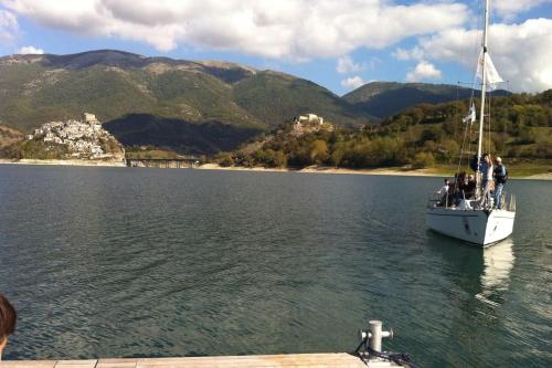 a group of people on a boat in the water at Casa sul lago Nonna Gio' in Colle di Tora