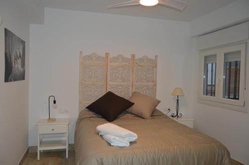 Posteľ alebo postele v izbe v ubytovaní ALCAZAR VIEJO SUITE Tourist Córdoba