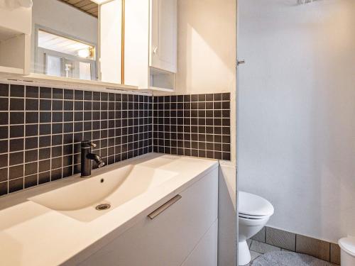 a bathroom with a sink and a toilet at 6 person holiday home in Otterup-By Traum in Otterup