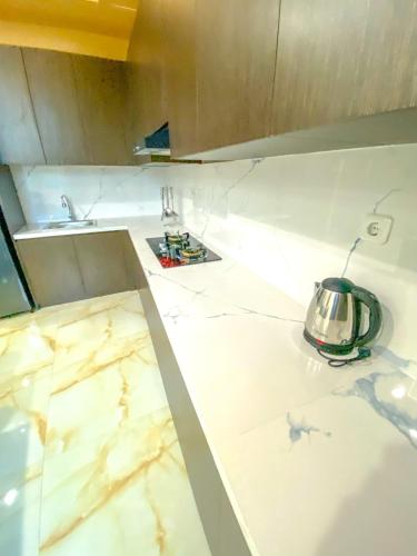 Kuchyň nebo kuchyňský kout v ubytování Algara Puncak Hotel