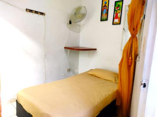Ein Bett oder Betten in einem Zimmer der Unterkunft Hotel San Gil Nómada