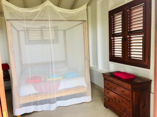 En eller flere senge i et værelse på Magnifique Villa Bauhinia, Piscine vue mer