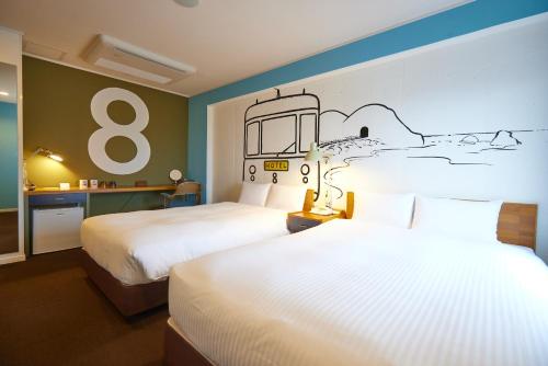 Postel nebo postele na pokoji v ubytování 8 Hotel Shonan Fujisawa