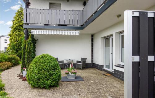 a patio of a house with a balcony at Awesome Apartment In Dillenburg in Dillenburg