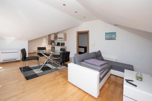 Sunny attic apartment with balcony & Modern city apartment with outdoor area, no balcony