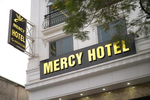 a macy hotel sign on the side of a building at Mercy Hotel in Hanoi