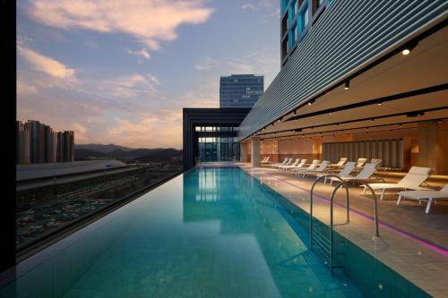 a swimming pool on the roof of a building at Take Hotel Seoul Gwangmyeong in Gwangmyeong