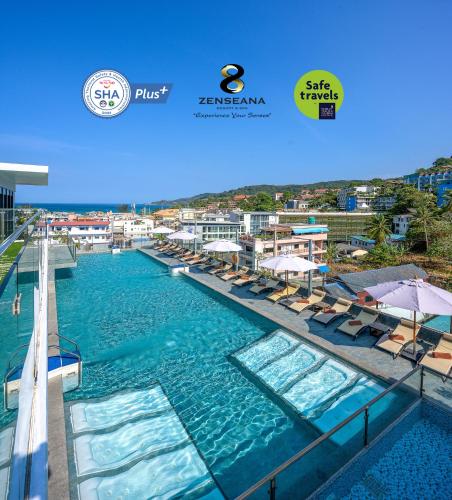 a pool with chairs and umbrellas in a resort at Zenseana Resort & Spa - Patong, Phuket in Patong Beach