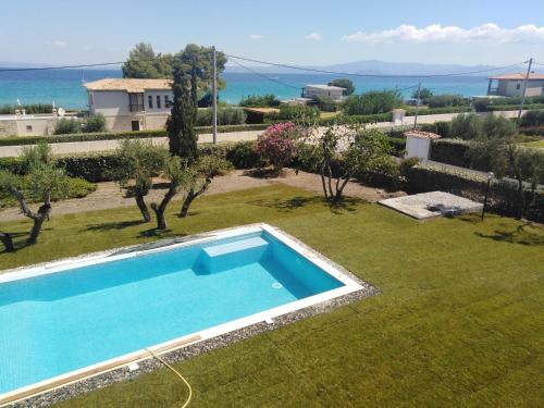 an image of a swimming pool in a yard at B A Seaside Villa private pool in Pefkochori