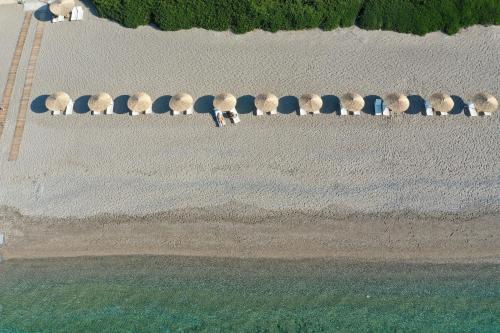 an aerial view of a beach with a group of domes at Niriides Resort in Gythio