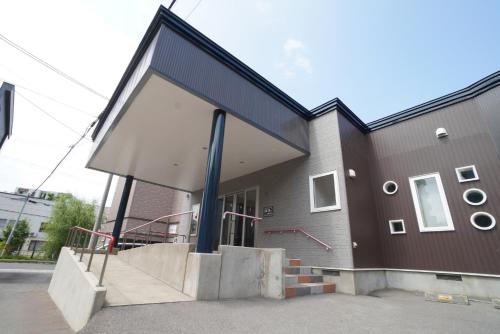 a building with a staircase in front of it at 桔恭(KIKYO) in Otaru