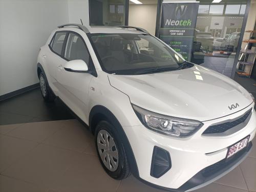 a white car is parked in a store at Golden Sands Beachfront Resort in Yorkeys Knob