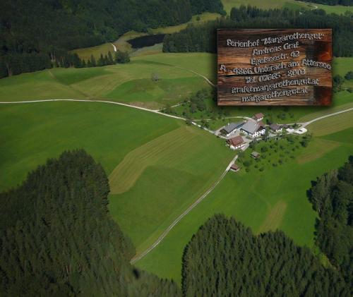 an overhead view of a farm with a large sign at Ferienhof Margarethengut in Unterach am Attersee