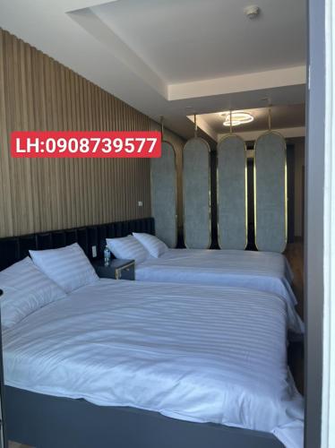 Cama o camas de una habitación en Căn Hộ TMS 28 Nguyễn Huệ - Xuan Phuong House