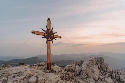 a wooden cross on top of a mountain at Apartment at the Achensee in Achensee