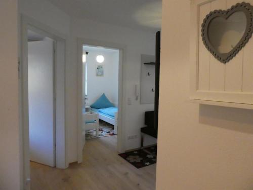 a room with a heart mirror on a wall at Ferienwohnung Marktstüberl in Mittenwald