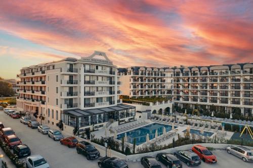 a rendering of a large hotel with a parking lot at Aquamarine - Beach & SPA Hotel- All inclusive in Kranevo