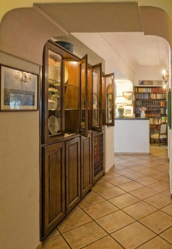 a room with a bunch of cabinets in a kitchen at Hotel Villa Maria Ischia Porto in Ischia