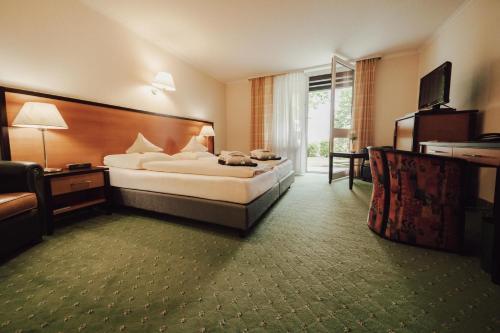 Ένα ή περισσότερα κρεβάτια σε δωμάτιο στο Hotel Summerhof