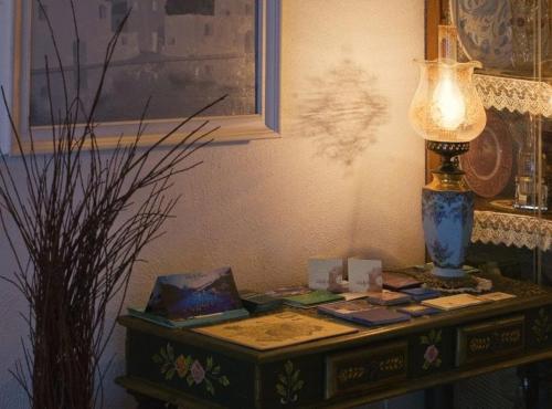 a table with a lamp on top of it at Hotel Villa Maria Ischia Porto in Ischia