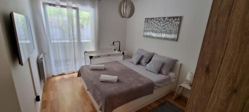 Posteľ alebo postele v izbe v ubytovaní City Style Apartment-New Zagreb