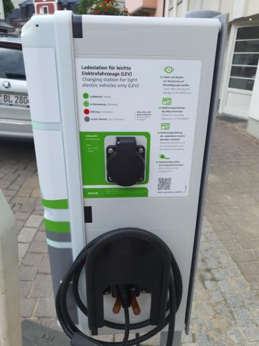 a machine with a picture of a black hose at Bachschneider Apartments - by myNests in Gröbming