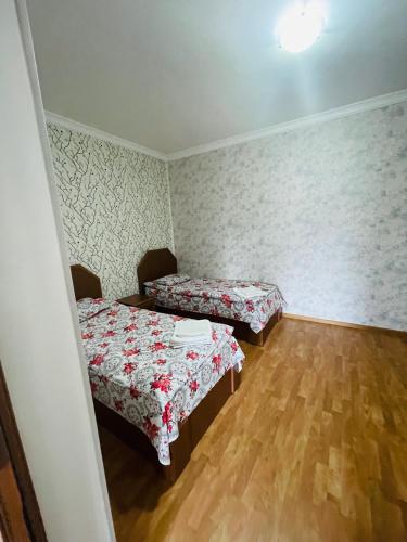 Postel nebo postele na pokoji v ubytování Hotel Romantika
