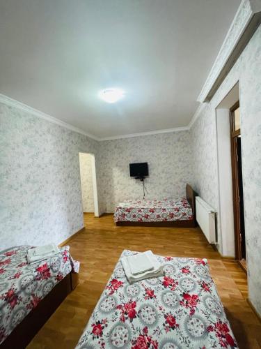Postel nebo postele na pokoji v ubytování Hotel Romantika