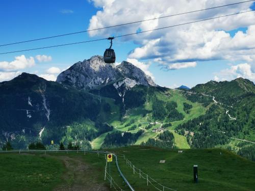 a ski lift in front of a mountain at Villa Hubertus Enzian in Kirchbach