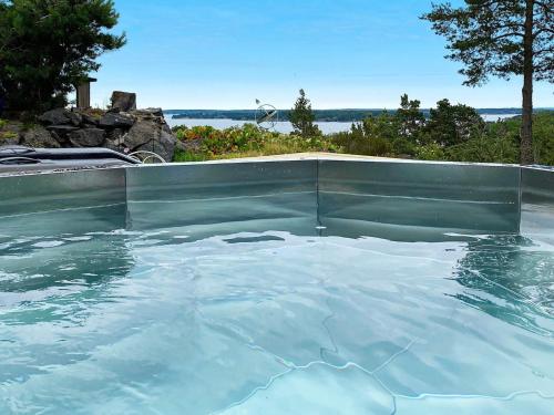 uma piscina cheia de água azul clara em 4 person holiday home in KERSBERGA em Åkersberga