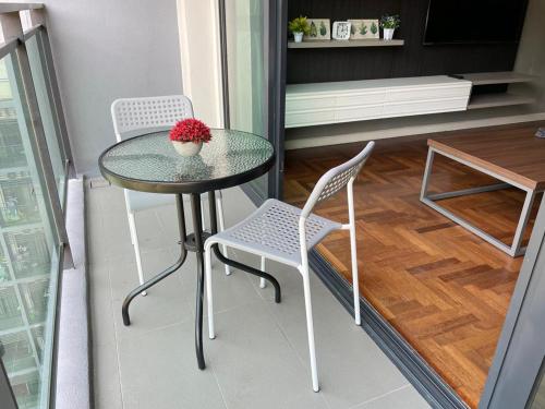 a small table and two chairs in a room at CHARMING & COZY PREMIER SUITES @ VISTA RESIDENCE in Genting Highlands