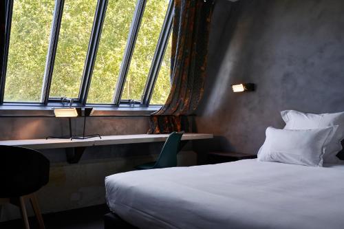 Кровать или кровати в номере Hotel La Zoologie & Spa Bordeaux