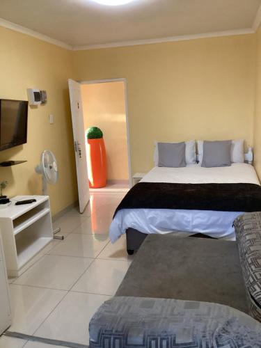 Katil atau katil-katil dalam bilik di Mowetu Guest House
