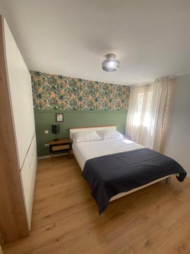 Ένα ή περισσότερα κρεβάτια σε δωμάτιο στο Apartman Oleandar