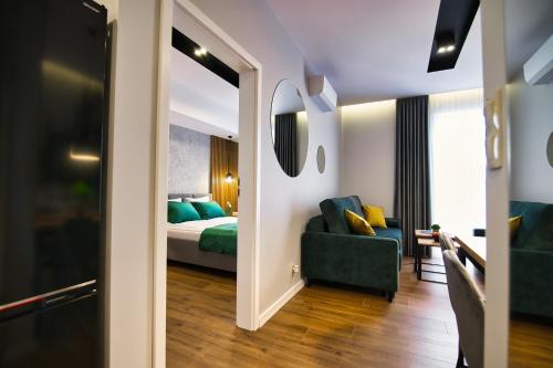 Postel nebo postele na pokoji v ubytování Capital apartaments