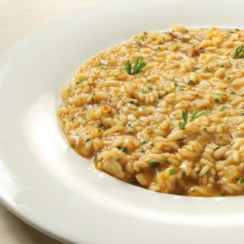 a white plate with a dish of macaroni and cheese at Villa Abbondanzi Resort in Faenza
