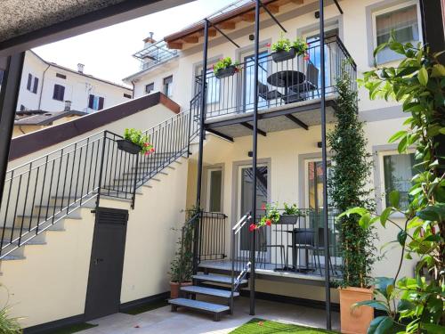 a house with stairs and plants on it at Sempione Boutique Hotel in Stresa