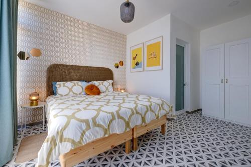a bedroom with a bed with a teddy bear on it at Sliema Creek Suites in Sliema