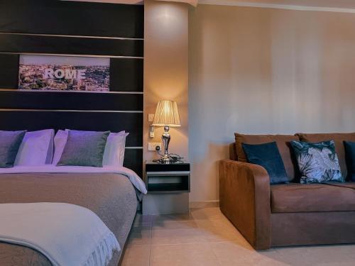 a bedroom with a bed and a chair at IL-Gardjola Bed and Breakfast in Għarb