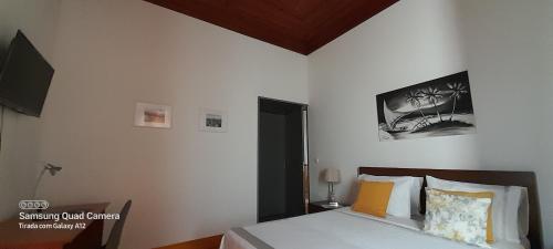 Ένα ή περισσότερα κρεβάτια σε δωμάτιο στο Casa Afonso - Passadiços do Paço