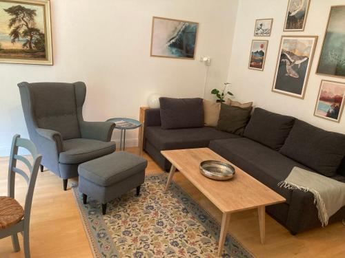 a living room with a couch and a table and chairs at Ostsee Hafenkoje - Lübeck-Travemünde Priwall in Lübeck